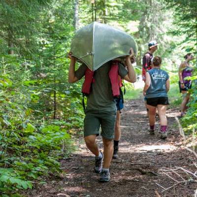 Student portaging a canoe - Undergraduate Minors